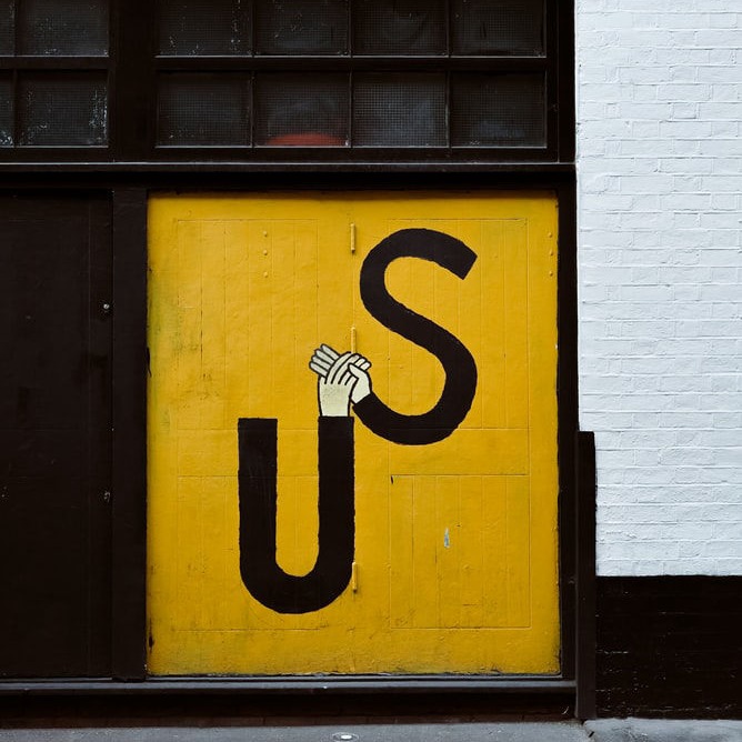wall written "us"